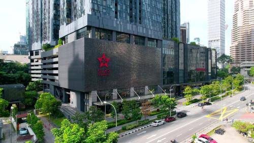 a building with a sign on it in a city at Star Residence 2br Unit Floor 46 in Kuala Lumpur