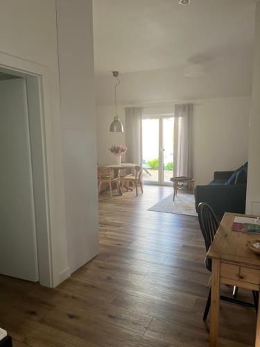 a living room with a couch and a table at Spokojnia in Lubrza