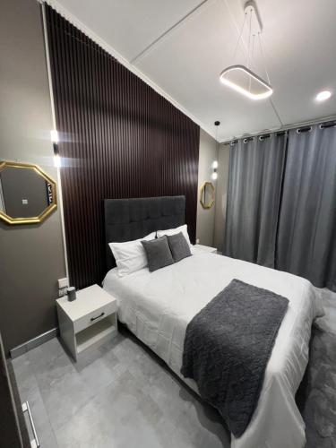 Ένα ή περισσότερα κρεβάτια σε δωμάτιο στο CM Luxury villa 1