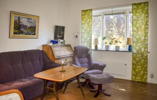a living room with a couch and two chairs and a table at 4 Bedroom Stunning Home In Löderup in Löderup