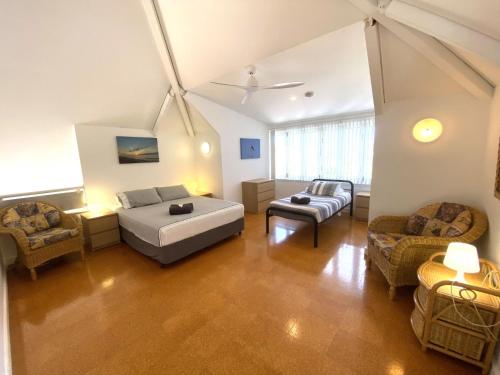 a large living room with a bed and a couch at Osprey Holiday Village Unit 111 in Exmouth