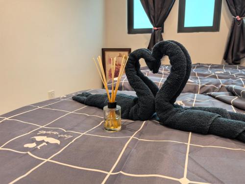 Ένα ή περισσότερα κρεβάτια σε δωμάτιο στο Sky Suite Meritus Residence in Perai
