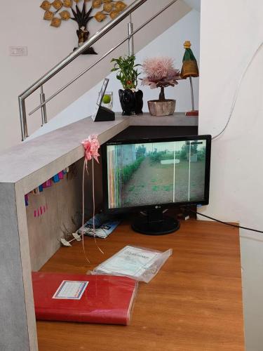 a computer monitor sitting on top of a wooden floor at Shri Resort & Lodging in Alta
