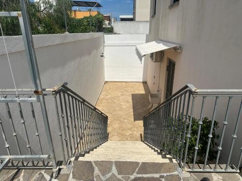 a stairway leading up to a building with a door at La Tavernetta del Salento in Poggiardo