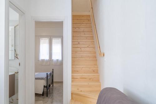 a staircase leading up to a room with a table at Littiricci in Marzamemi