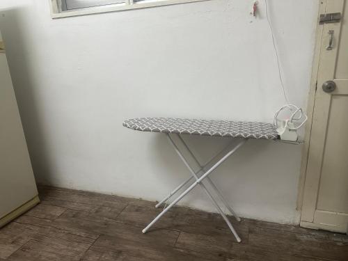 a table in the corner of a room at Jenny Homestay in Teluk Intan