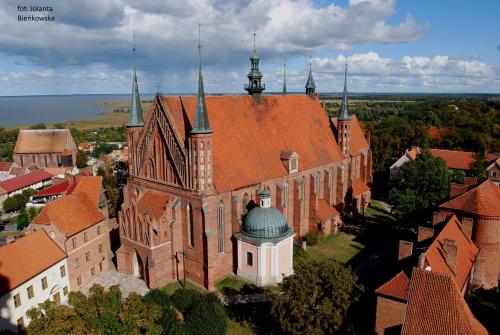 an aerial view of an old building with a turret at Hotel Młyn Aqua Spa Biblioteka in Elblag