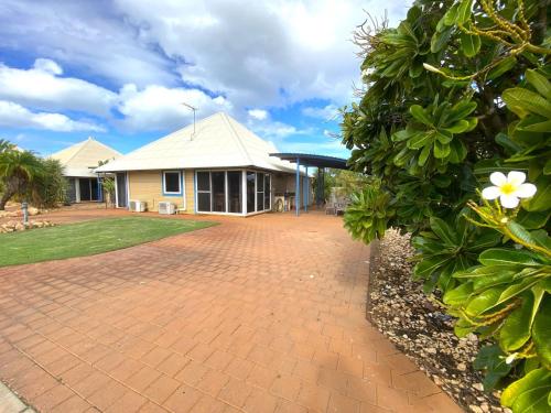 a house with a brick driveway in front of it at Osprey Holiday Village Unit 113 2 Bedroom in Exmouth