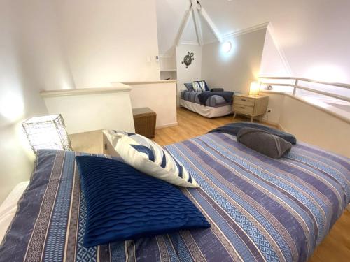 a bedroom with a bed with two pillows on it at Osprey Holiday Village Unit 113 2 Bedroom in Exmouth