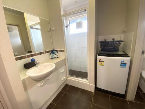 a small bathroom with a sink and a mirror at Osprey Holiday Village Unit 113 2 Bedroom in Exmouth