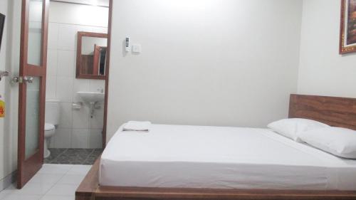 Katil atau katil-katil dalam bilik di Vinandaka Homestay