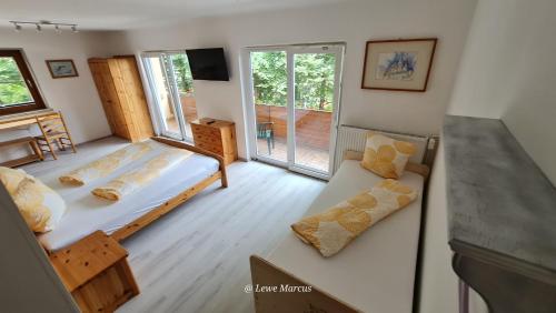 Ένα ή περισσότερα κρεβάτια σε δωμάτιο στο Appart-Pension Seehang