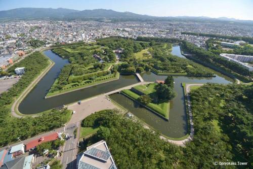 an aerial view of a park with a river at 函館民泊イナンクル in Hakodate