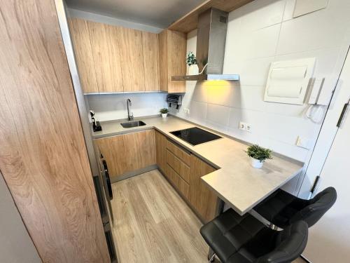 a small kitchen with a sink and a counter at Beach Apartment, Torre Benagalbón in Torre de Benagalbón