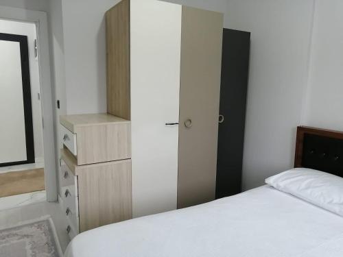Postel nebo postele na pokoji v ubytování AhmetsS Home