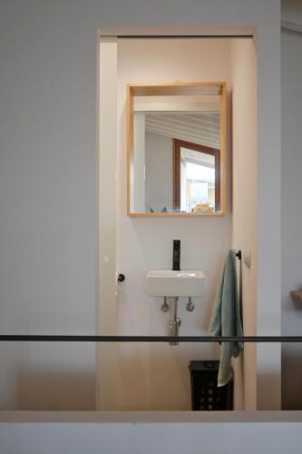 a bathroom with a sink and a mirror at Ayamans Home Lloseta in Lloseta