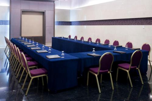a conference room with a long table and chairs at Crowne Plaza Amman by IHG in Amman