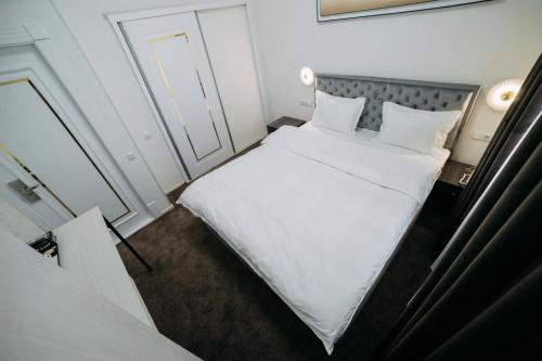 a small room with two beds in it at Central Plaza Hotel in Urganch