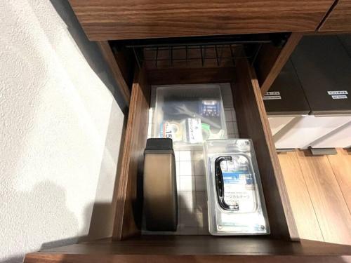 a drawer in a kitchen with a refrigerator at Peaks Home 201 in Higashikawa