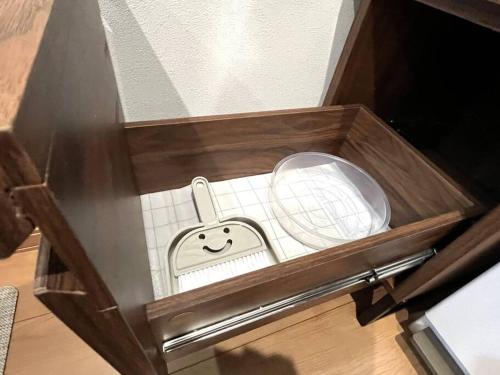 a wooden box with a toy in it at Peaks Home 201 in Higashikawa