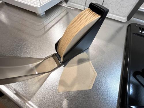 a knife with a book on top of a counter at Peaks Home 201 in Higashikawa