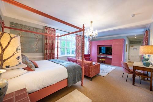 a bedroom with a large bed and a tv at The Assembly House in central Norwich in Norwich