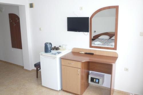 a bathroom with a sink and a mirror at Къща за гости Мишел in Nesebar