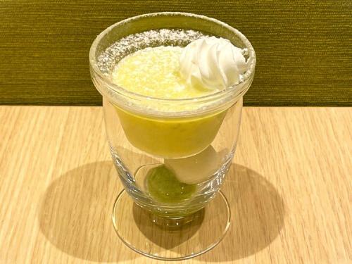 a dessert in a glass with whipped cream on a table at APA Hotel TKP Sendai Eki Kita in Sendai