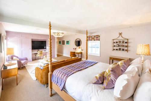 a bedroom with a bed and a living room at The Assembly House in central Norwich in Norwich