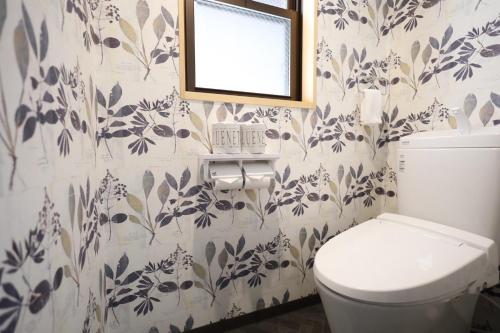a bathroom with a toilet and a mirror on the wall at Hotel Amaranth Kyoto Gojo - Vacation STAY 19866v in Kyoto