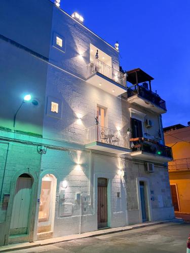 a large white building with two balconies on it at DIMORA BIANCA in Triggianello