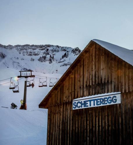 a sign on the side of a building with a ski lift at s´Amagmach in Egg