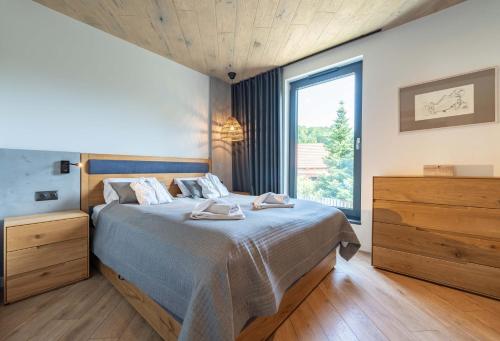 Postel nebo postele na pokoji v ubytování Apartamenty Kalinowa z sauną i bawialnią - Dream Apart