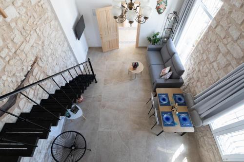 an overhead view of a living room with a staircase at Las Casitas Del Mar in Alicante