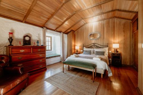 En eller flere senge i et værelse på HAGAH Alojamentos - Gerês