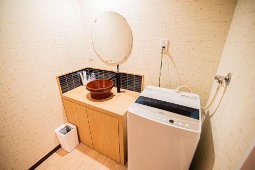a small bathroom with a sink and a mirror at Hotel Amaranth Kyoto Gojo - Vacation STAY 19876v in Kyoto