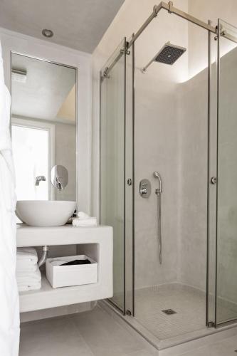 a bathroom with a shower and a sink at Art Hotel Santorini in Pirgos