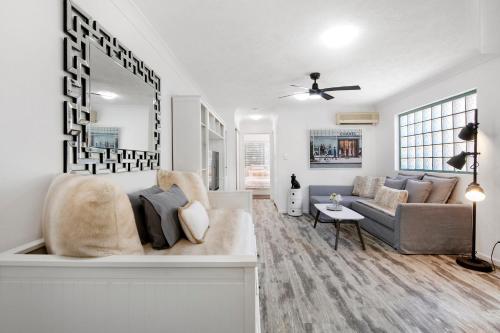 a living room with a couch and a table at Pets Paradise - Top location with FREE parking in Gold Coast