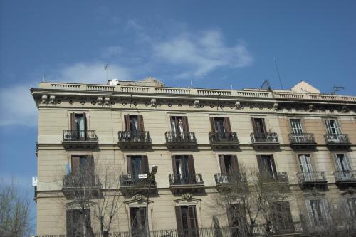 a large white building with a lot of windows at Pension Ciudadela in Barcelona