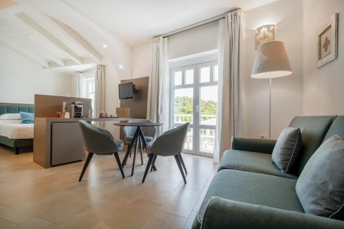 Postel nebo postele na pokoji v ubytování Felix Hotels - Hotel La Coluccia