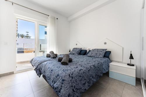 En eller flere senge i et værelse på Apartamento Miguel Marquez Casajari