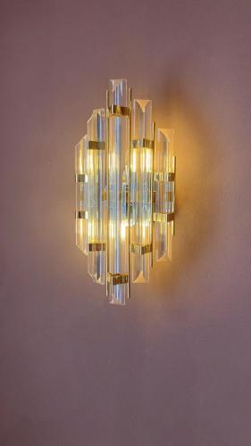 a chandelier hanging from a wall at MalaQuita Hotel Boutique in Santa Eularia des Riu