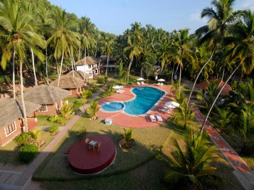 an aerial view of a resort with a swimming pool at Abad Harmonia Ayurvedic Beach Resort in Kovalam