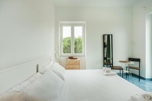 Ein Bett oder Betten in einem Zimmer der Unterkunft Il Poeta nella Vigna