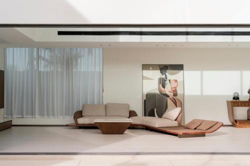 a living room with a couch and a table at Sun Diego Resort Pool Villa in Jomtien Beach