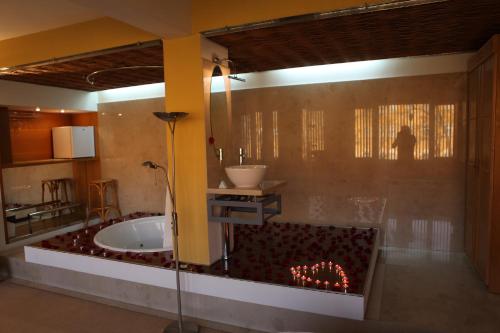 a bathroom with a bath tub in a room at Hotel Central in Timişoara