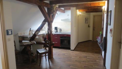 a kitchen with a counter and a stove top oven at Märchenpension Rotkäppchen und der Wolf in Großwaltersdorf