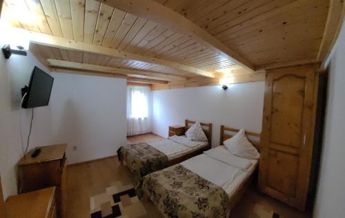 Llit o llits en una habitació de Casa Ursului