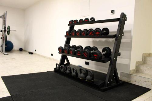 a rack of dumbbells in a gym at Hotel Turist in Varaždin