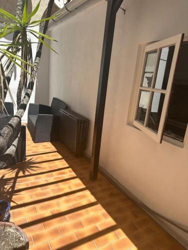 a room with a window and a palm tree at REPUBLIC - Right in the center of the old town in Antibes